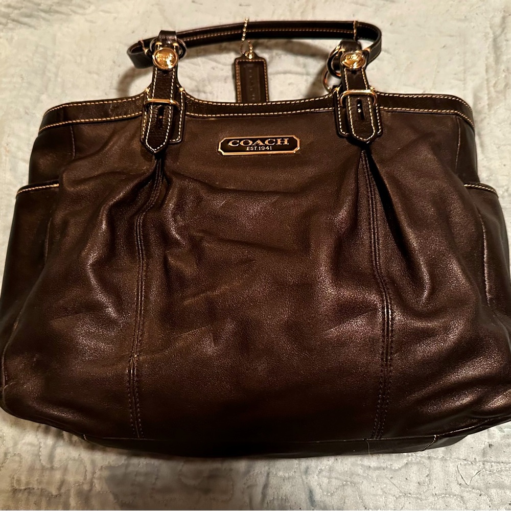 Authentic black leather Coach purse. Zipper closure. Handles. No rips or tears